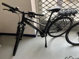 a bicycle that is parked in front of a window