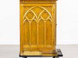 an image of a wooden cabinet on a dolly in a room