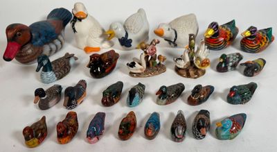 a lot of figurines that are sitting on a table