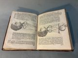 an open book with a drawing of a bird and a fish on it