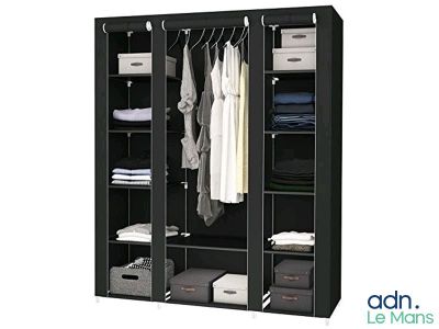 an image of a closet with clothes hanging on it