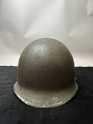 an image of a helmet on a black cloth with a white background