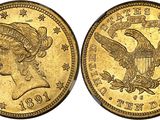 a gold coin with an eagle on the front and a woman ' s head on the back
