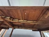 a wooden table with a wooden top and wooden legs