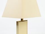 lamp in the shape of a cube with a beige shade on a white background