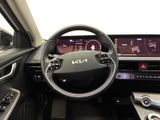 the interior of a car with a steering wheel, dashboard, and display screen