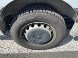 a close up of a tire on the side of a truck