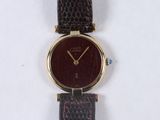 an image of a close up of a wrist watch on a white surface