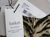 a zebra print skirt with a tag on it