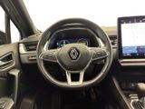 the interior of a car with a steering wheel, dashboard, and touch screen