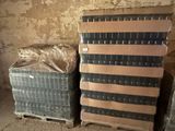 two boxes of mattresses in a room with a wall in the background