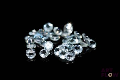 some very pretty white diamonds on a black surface