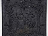 an old black plaque with a picture of a group of people on it