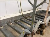 a dolly cart with a hand truck attached to it