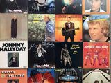 many albums of johnny hallydy on the wall