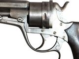 a gun that is sitting on a white surface