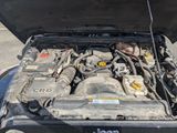 a car with its hood open and the engine in it