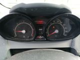 a close up of a car dashboard with a speedometer and gauges