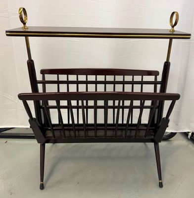 a wooden magazine rack with a magazine holder on top of it