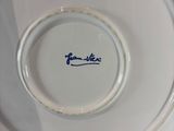 a white plate with a blue writing on it