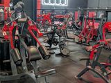 a gym with a lot of machines in it