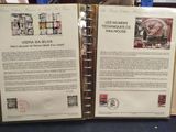 two pages of a book with stamps on them