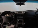 a picture of a dashboard of a car with a cat in it