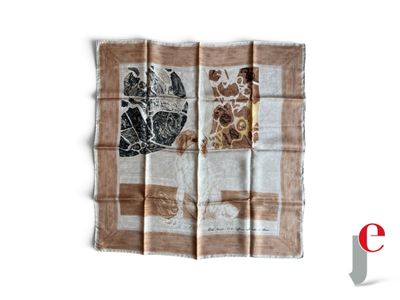 une écharpe marron et blanche avec une girafe dessinée dessus