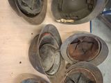 many helmets that are sitting on a table