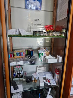 a glass display case with various items in it
