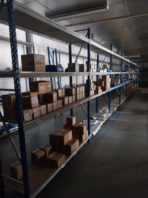 many boxes on the shelves in the warehouse