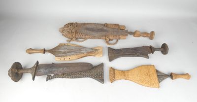 several pieces of wood and metal are displayed on a white surface