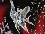 a picture of a painting of birds and flowers on a red background