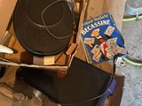 a cardboard box with a grill on top of it