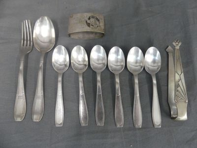 a lot of silver spoons and spoon spoons on a table