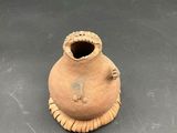 a small vase that is sitting on a table