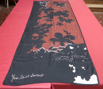 a long table with a red table cloth on it