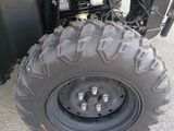 an image of a close up of the front tire of a four wheeler atv