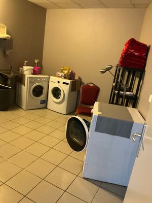 an image of a laundry room with a washer and dryer