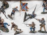 many figurines of soldiers in a display case