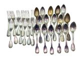 a lot of silver spoons and forks on the table