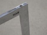 a close up of a metal frame with a small hole in it