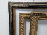 three different sized picture frames sitting next to each other on a wall