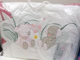 a white pillow with a picture of two teddy bears on it
