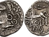 a silver coin with an image of a man on it