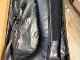 a box with a pair of black boots in it