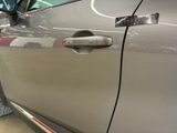 a close up of a car door handle with a sticker on it