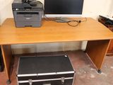 a computer and printer sitting on a wooden desk