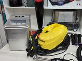 a yellow and black vacuum sitting on a desk