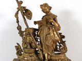 bronze figurine of a woman with a staff and a dog